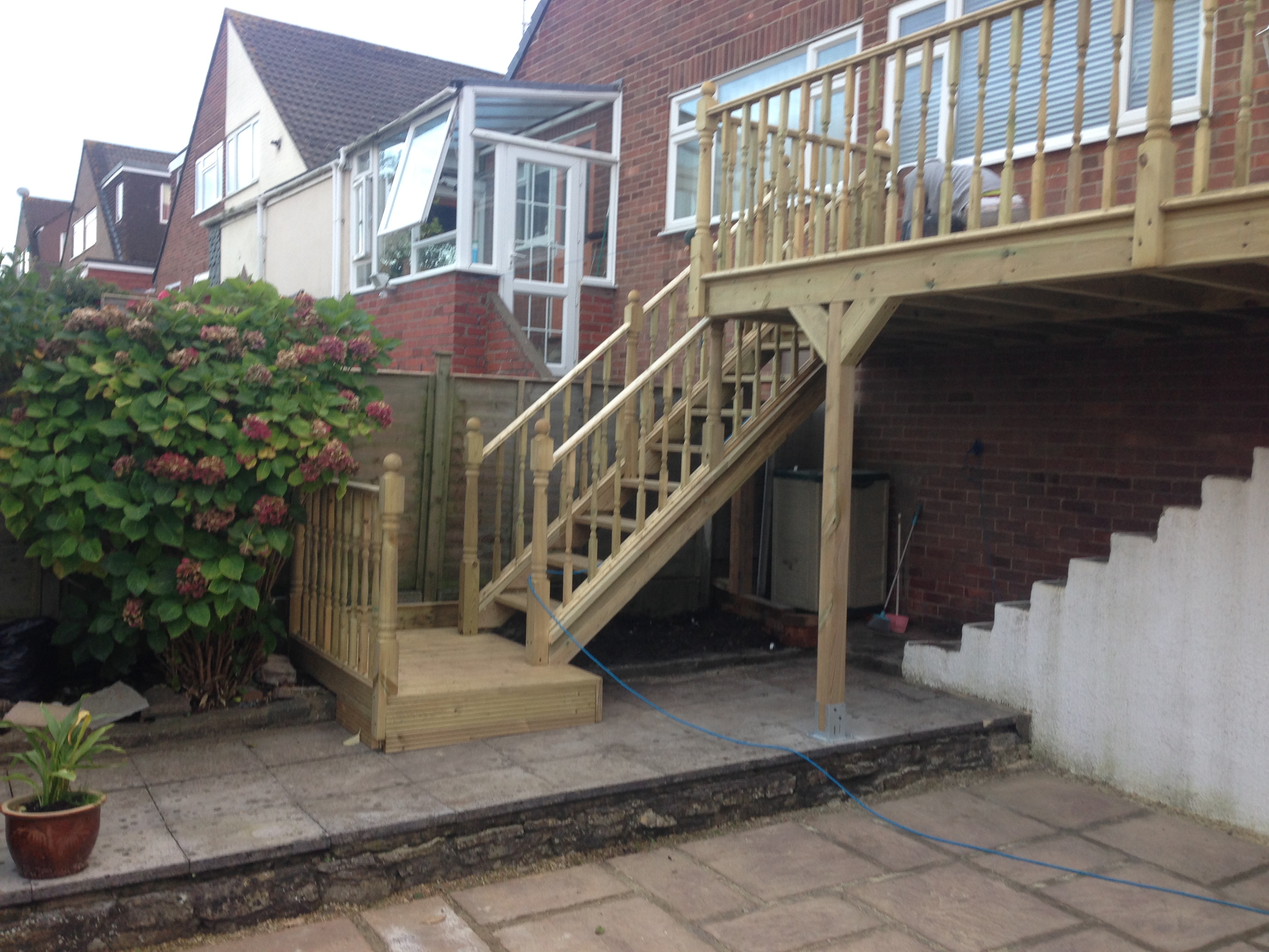 wooden outdoor staircase leading to property