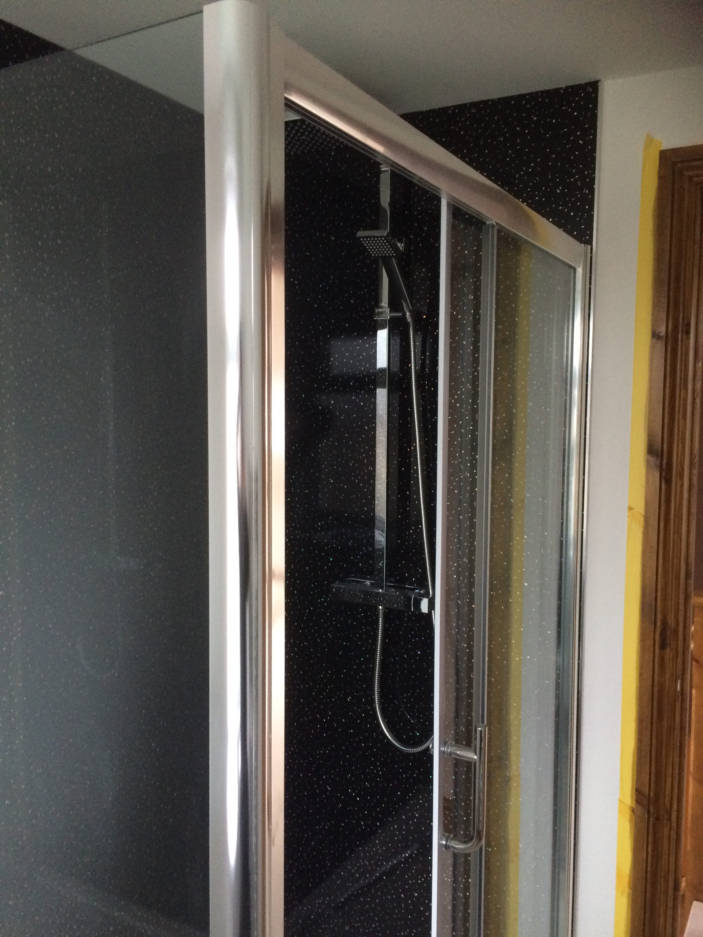 Shower with black sparkly tiles