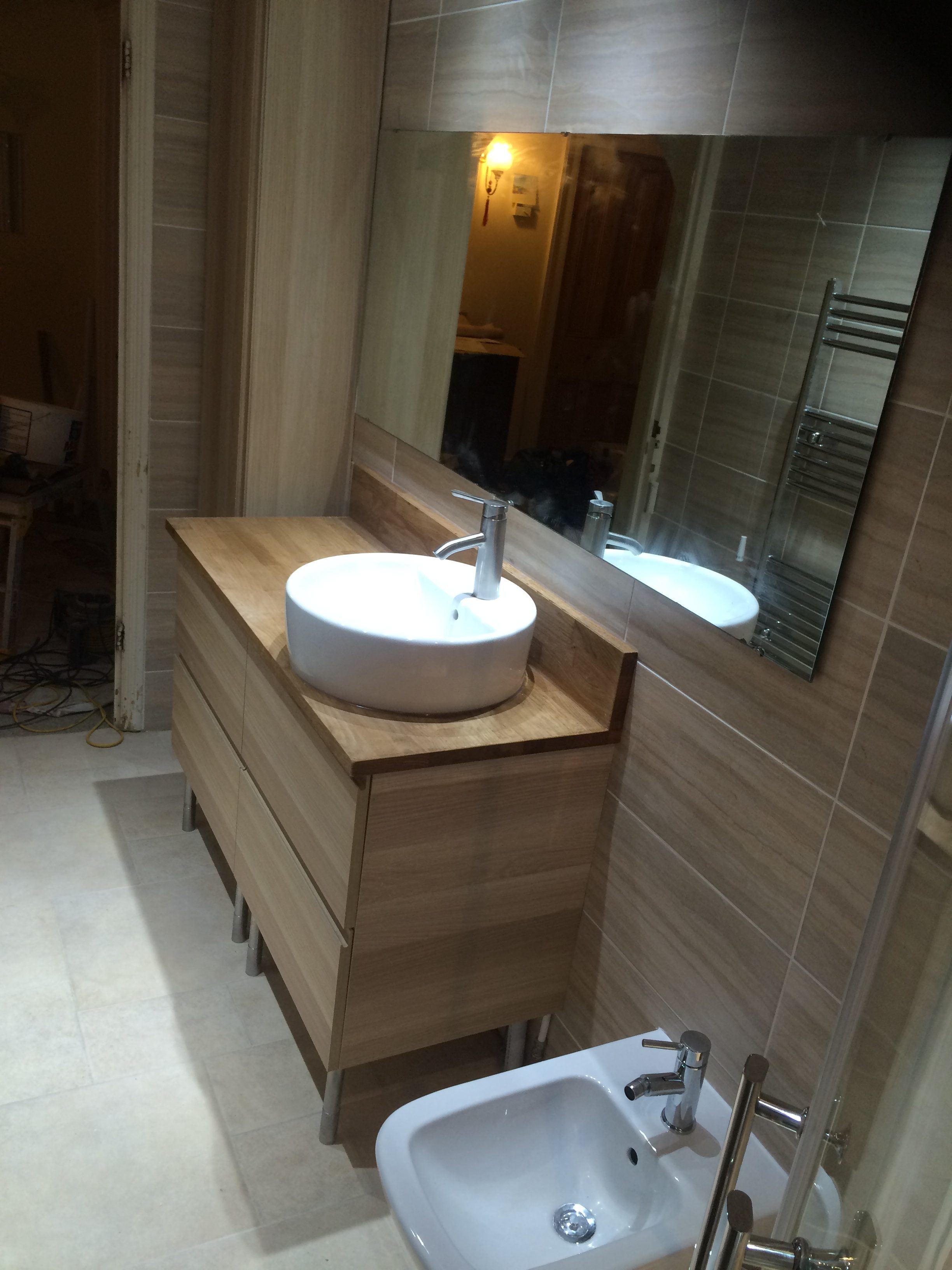 sink in modern, wooden themed bathroom